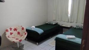 Apto 10: salacozinha,1quarto(ar e 2 camas)cgarag