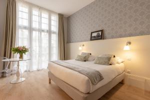 Appartements La Maison Blanche - AppartHotels climatises de charme Chic & Cosy - Centre-ville : photos des chambres