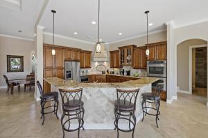 Opulent waterfront home with pool, spa, dock and deck