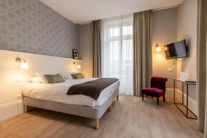 Appartements La Maison Blanche - AppartHotels de charme Chic & Cosy a 350m du coeur de ville de Limoges - Acces autonome : photos des chambres