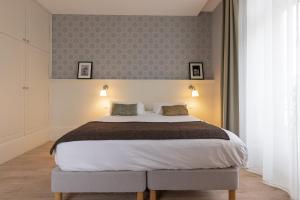 Appartements La Maison Blanche - AppartHotels de charme Chic & Cosy a 350m du coeur de ville de Limoges - Acces autonome : photos des chambres