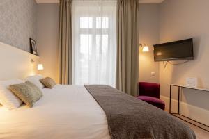 Appartements La Maison Blanche - AppartHotels de charme Chic & Cosy a 350m du coeur de ville de Limoges - Acces autonome : photos des chambres