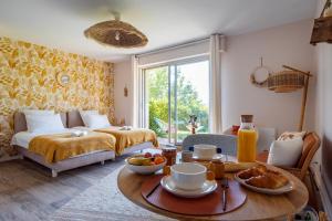 Appartements Le Nichoir de la Colline - Parking & Wifi : photos des chambres