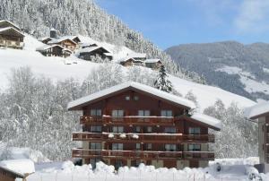 Appartements At the foot of the ski school : photos des chambres