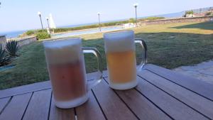 Blue Pastel-cliffside villa, shared pool, wild sandy beach nearby