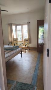 Karimbummel House- A room with spacious Balcony