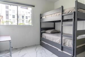 Apartamento con Alberca SmartTV y Jardin