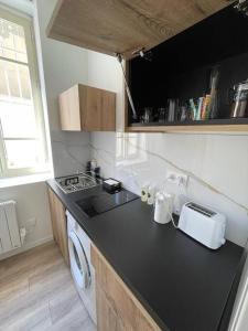 Appartements T1 Contemporain Proche du stade appart 101 : photos des chambres