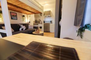 Appartements Le Petit Plus - studio confortable avec parking : photos des chambres