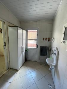 Casa aconchegante com ar condicionado para família em condomínio