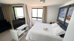 FLAT DE FRENTE PARA O MAR