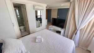 FLAT DE FRENTE PARA O MAR