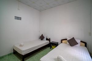 Phòng Hạng Tiết kiệm Cho 4 Người (Economy Quadruple Room)