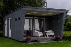 Tiny house aan het water op de appelhof