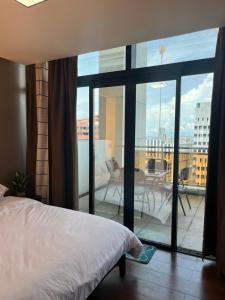 Appleone Ayala Condo with Balcony