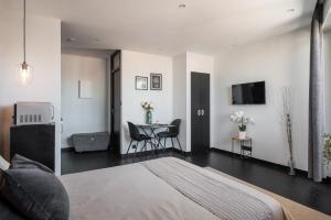 Appartements Studio black & white a 10 mins a pieds de la gare pour Geneve : photos des chambres