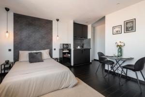 Appartements Studio black & white a 10 mins a pieds de la gare pour Geneve : photos des chambres