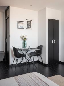 Appartements Studio black & white a 10 mins a pieds de la gare pour Geneve : photos des chambres