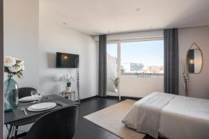 Appartements Studio black & white a 10 mins a pieds de la gare pour Geneve : photos des chambres