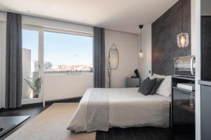 Appartements Studio black & white a 10 mins a pieds de la gare pour Geneve : photos des chambres