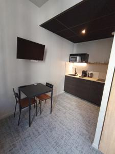 Appartements Le 12 studio neuf wifi app 11 : photos des chambres