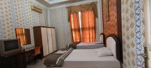 Hotel O Wisma Hamalau SyariahNearPulau Bromo Pedestrian Bridge