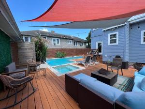 GrandCraftsman style home with pool and hot tub center toof New Orleans
