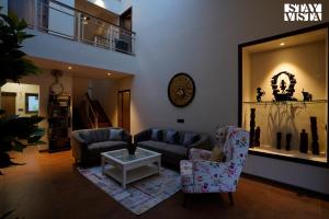 StayVistas Skylight Serenity with Modern Interiors, Outdoor Pool, Poolside Gazebo, Manicured Lawn