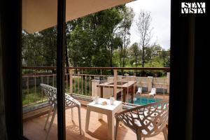 StayVistas Skylight Serenity with Modern Interiors, Outdoor Pool, Poolside Gazebo, Manicured Lawn