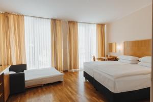 Room with One King Bed Or Two Twin Beds - Non-Smoking room in Ramada Hotel & Suites Kranjska Gora