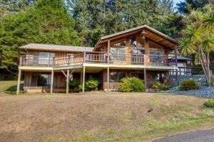 Tree-Lined Gold Beach Retreat with Multiple Decks!