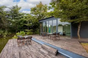 StayVista's Water Song Garden - Lake-Side, Pet-Friendly Villa with Bar, Spacious Lawn & Indoor-Outdoor Games - Bhāmgarh