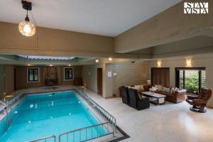 Otonia by StayVista with Indoor swimming pool, Modern interiors & a mix of indoor & outdoor games
