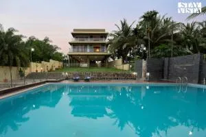 StayVista's Rivulet Waters - Lakefront Villa with Infinity Pool, Jacuzzi, Lawn, and Rustic Gazebo - Manchar