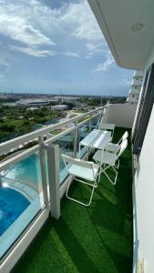 Two Bedroom with Balcony by The Bali Corner at Azure North , POOL and BEACH VIEW - unit with Bathtub