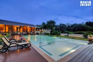 StayVista at The Earthen Boutique with Spacious Pool, Terrace, Lawn & Games