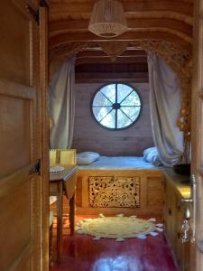 Tentes de luxe La roulotte du petit paradis : photos des chambres
