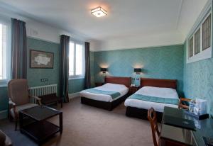 Hotels Le Grand Hotel : photos des chambres