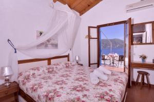 KAMINAKIA Apartments-Adults only -Walka tranquil oasispeace & quiet are wovenevery breath -Nestled within a serene evergreen cypress forest, each Apartment opens wide to the endless sea and a sunbathed pool awaits to soothe your senses