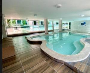 Apartamentos com piscinas na praia de Bombas