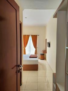 Adiputra Guesthouse Tata Bumi by HomiQ