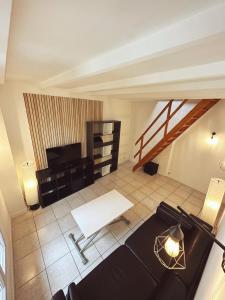 Appartements La Suite - Charmant duplex proche Paris : photos des chambres