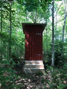 Tree-tent overlooking lake in private woodland