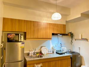 Cozy 1 BR ScandinavianTropical Condo with Balcony & Parking