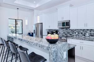 New listing - Amazing new 3beds3baths Gulf access villa w. heated pool and outdoor kitchen!