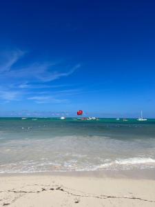 Fully renovated Beachfront 1BR Condo in the gated Stanza Mare community with a private beach, pool, onsite restaurant and modern amenities such as refrigerator, dishwasher, filtered water, microwave, BBQ, washer dryer, bamboo linens, free Wi-Fi