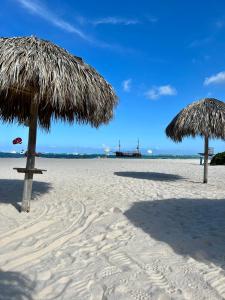 Fully renovated Beachfront 1BR Condo in the gated Stanza Mare community with a private beach, pool, onsite restaurant and modern amenities such as refrigerator, dishwasher, filtered water, microwave, BBQ, washer dryer, bamboo linens, free Wi-Fi