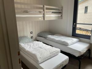 Chalets Cottage dans Parc Residentiel de Loisirs, Piscine, 150M de la mer : photos des chambres