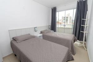 215 - Apto confortável na praia de Bombas