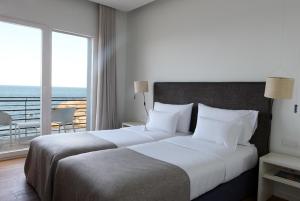 Double Room with Sea View and Balcony room in Hostal Spa Empúries